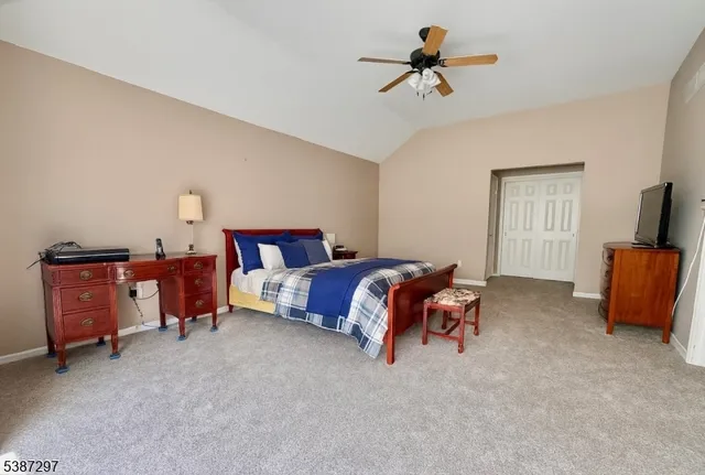 a bed room with a bed and a chandelier