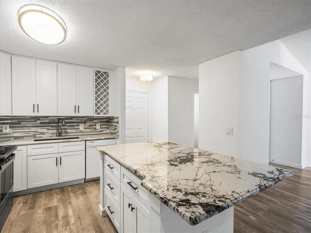 a kitchen with a sink and cabinets