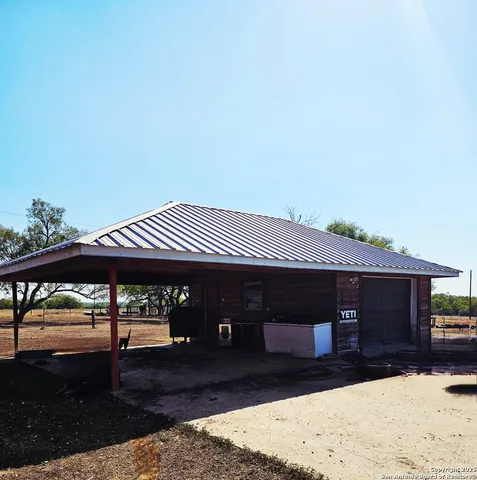 a view of a swimming pool with outdoor seating