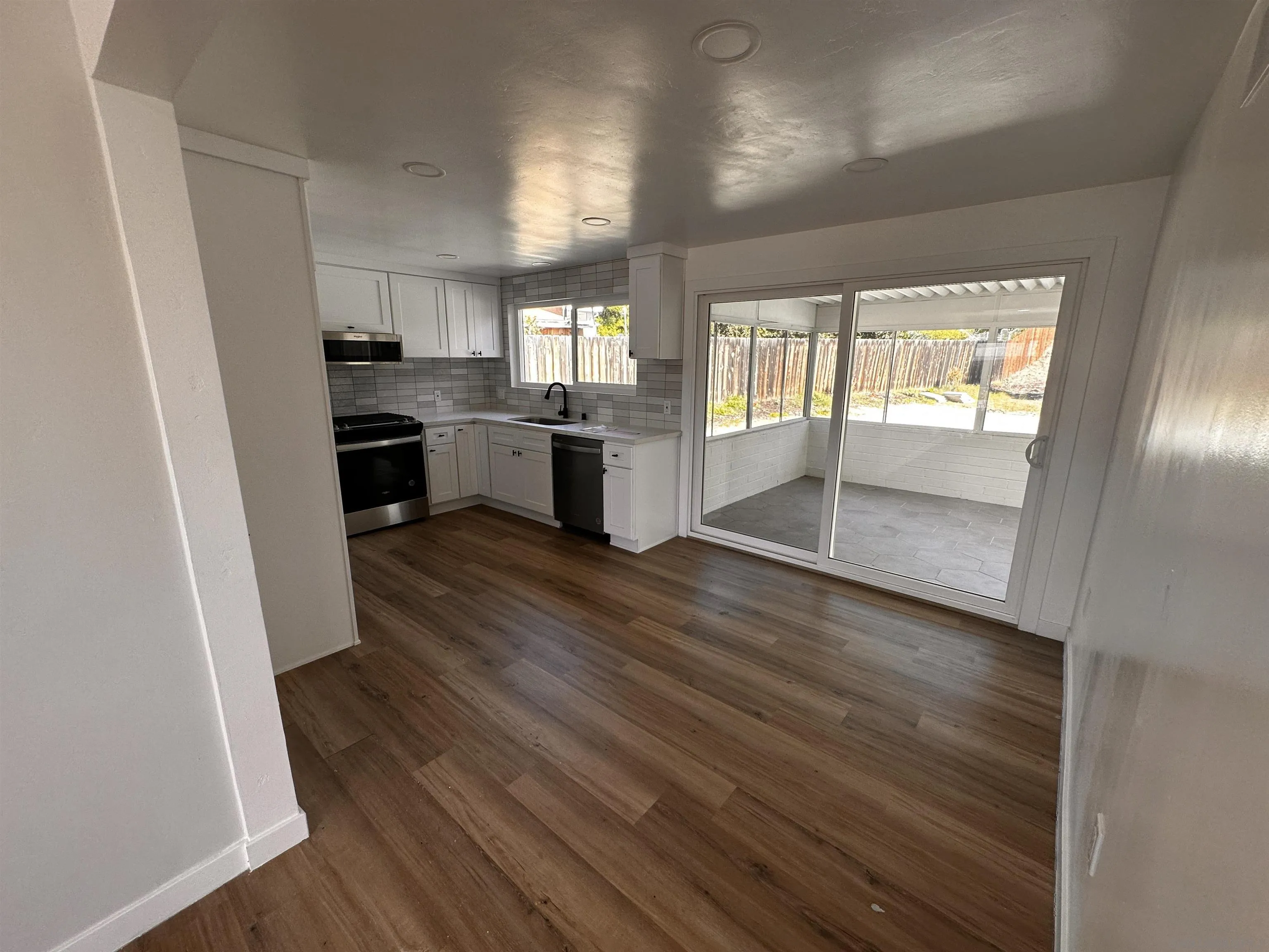 12733 McFeron Road Poway, CA 92064 - Photo 18 of 69 a kitchen with granite countertop a stove and a refrigerator