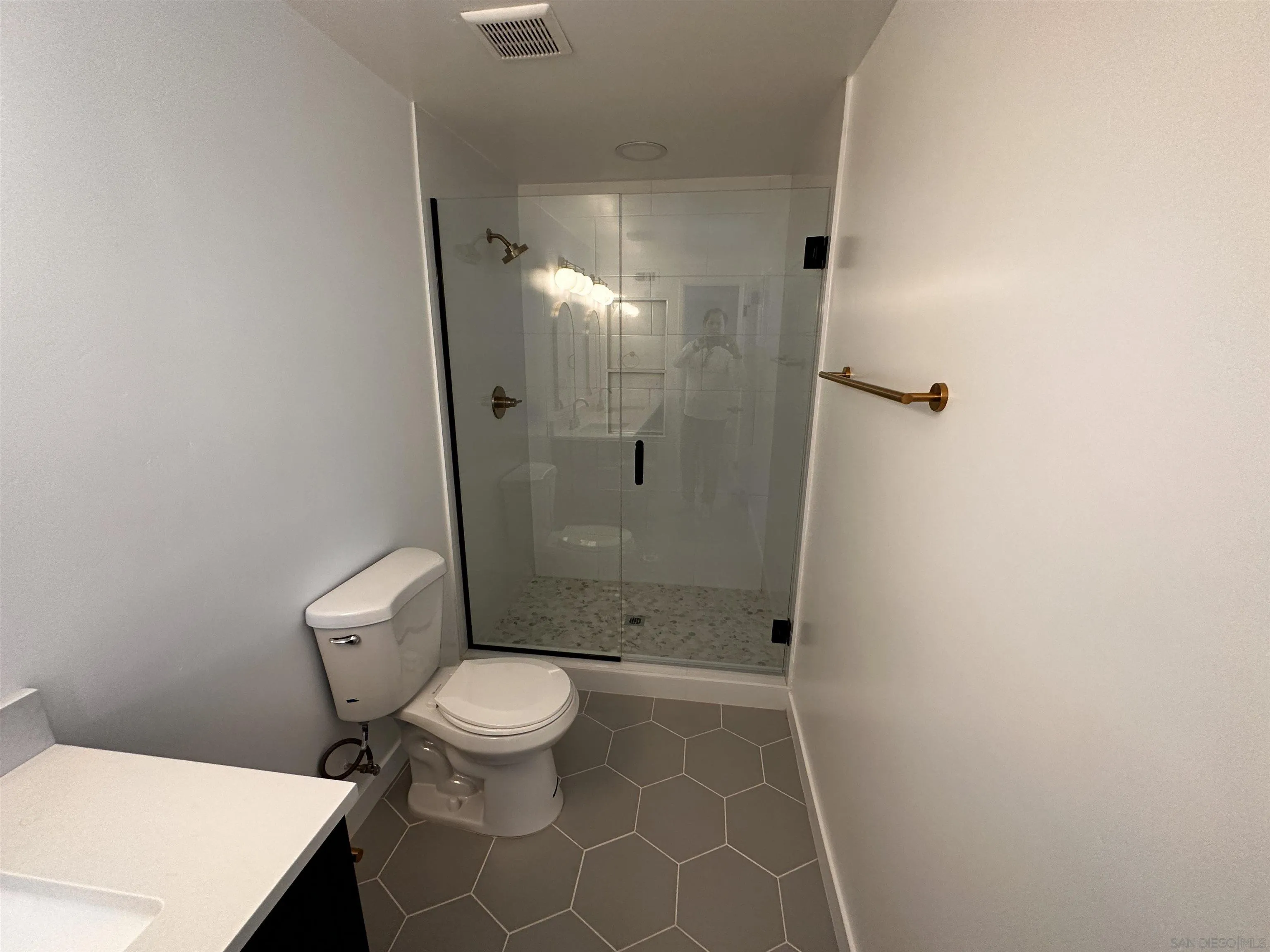 12733 McFeron Road Poway, CA 92064 - Photo 24 of 69 a bathroom with a toilet and a shower
