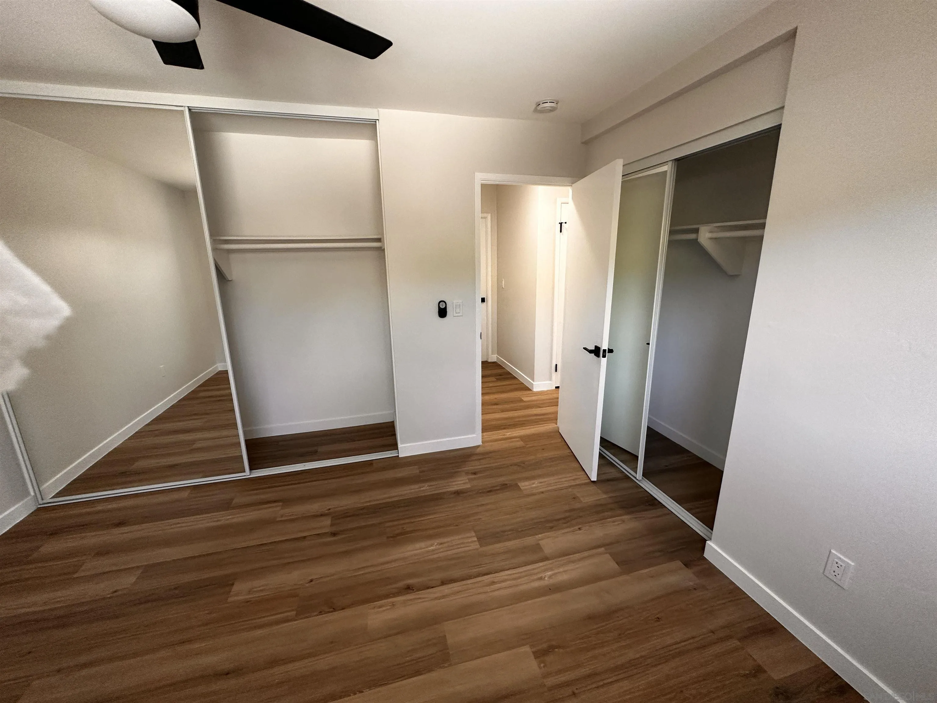 12733 McFeron Road Poway, CA 92064 - Photo 28 of 69 a view of an empty room with wooden floor