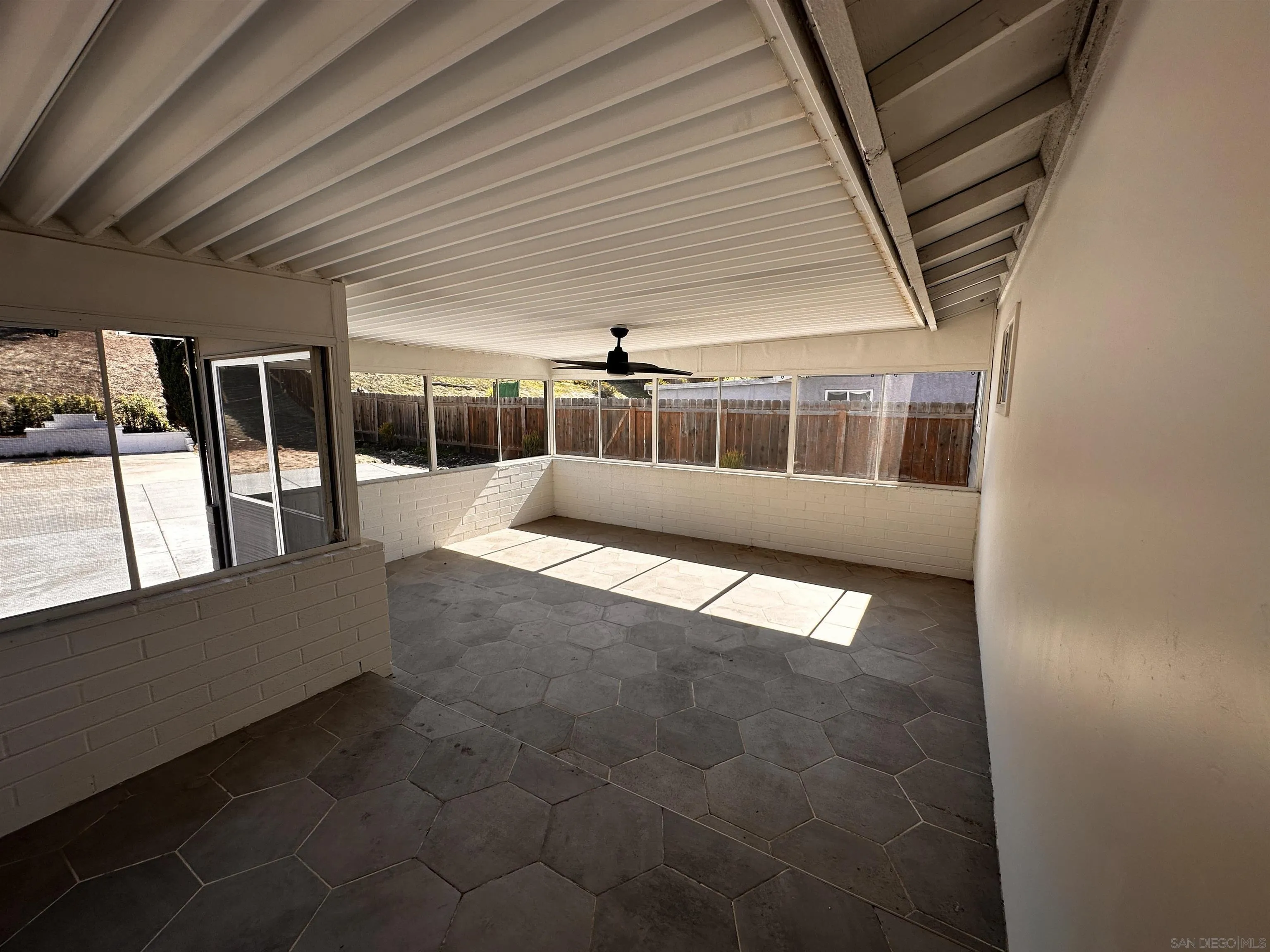 12733 McFeron Road Poway, CA 92064 - Photo 36 of 69 a view of an empty room with wooden floor and a window