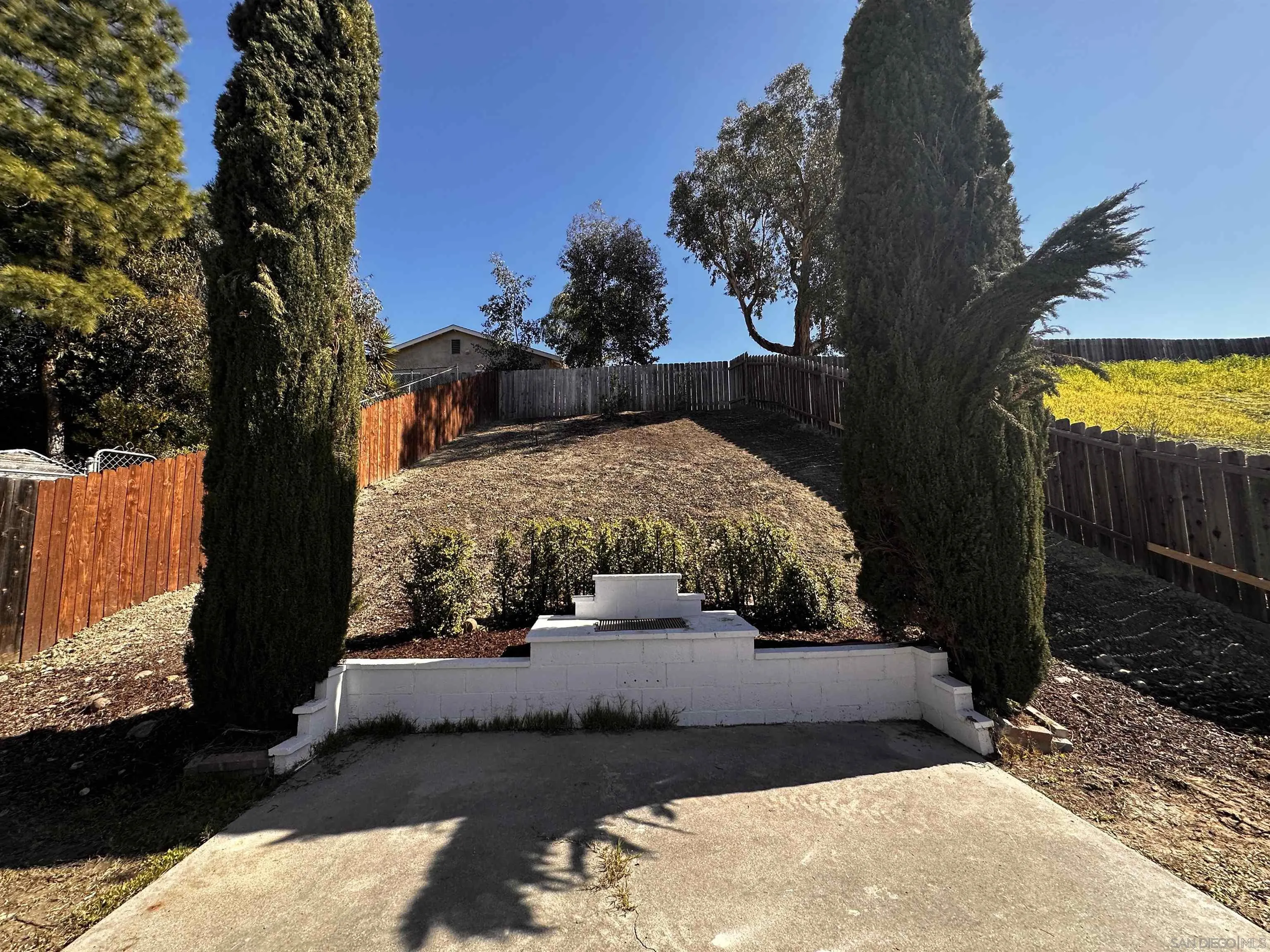 12733 McFeron Road Poway, CA 92064 - Photo 43 of 69 a view of a yard in front of a house with a large tree