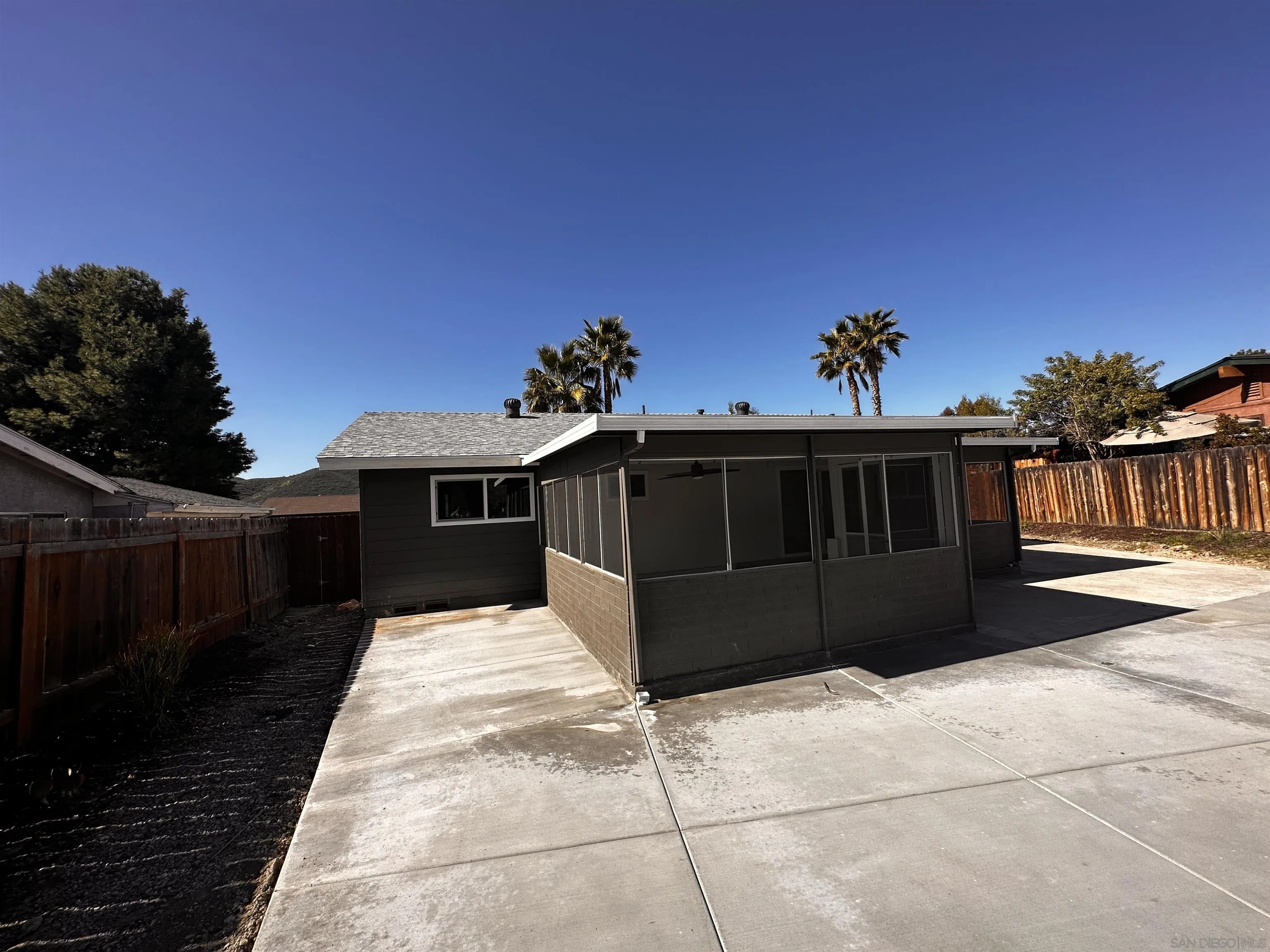 12733 McFeron Road Poway, CA 92064 - Photo 52 of 69 a view of a house with a yard
