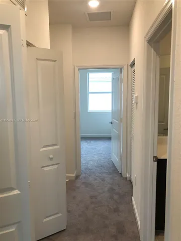 a bathroom with a shower sink and mirror
