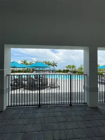 a lobby with furniture and a flat screen tv
