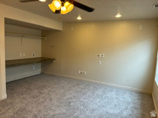 7936 Wycliffe Way Eagle Mountain, UT 84005 - Photo 34 of 37 Carpeted room featuring a built-in counter space with shelving, a ceiling fan, and recessed lighting