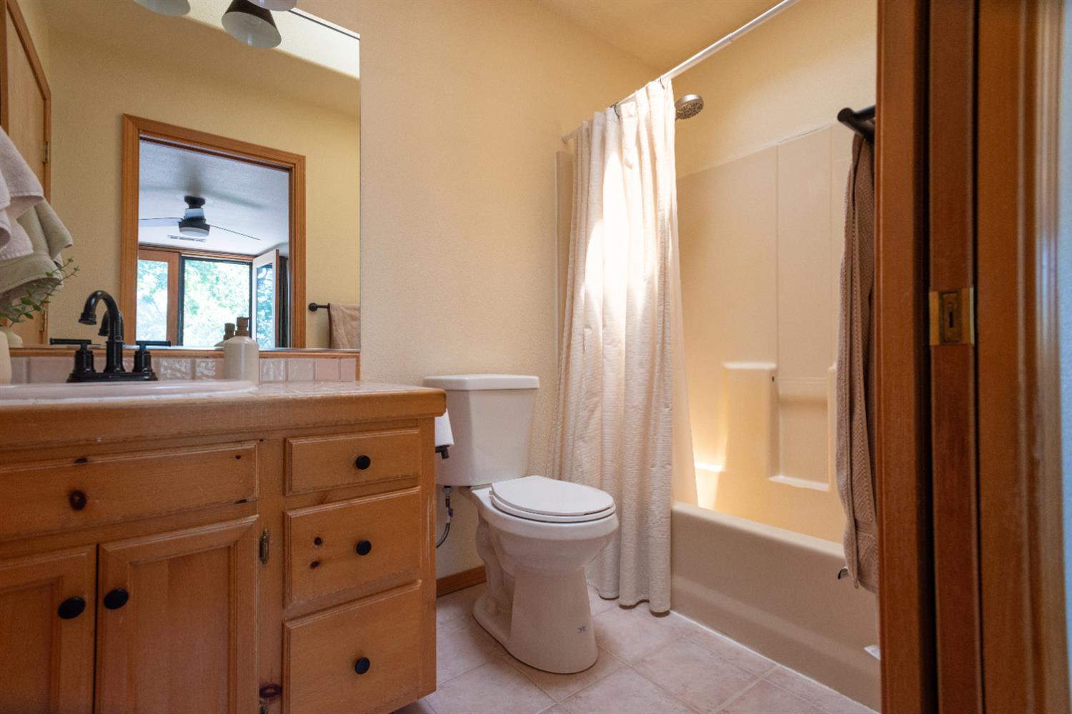 34075 Shaver Springs Road Auberry, CA 93602 - Photo 11 of 38 a bathroom with a sink toilet and shower