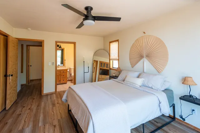 a bedroom with a bed and a television