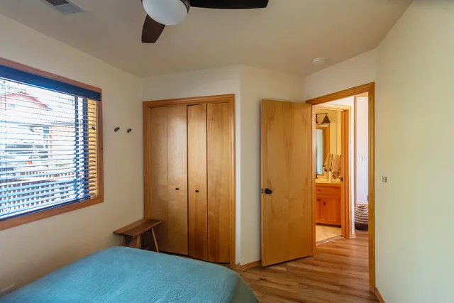 a bathroom with a granite countertop shower and a toilet