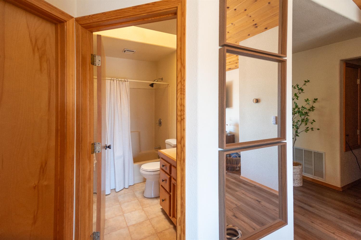 34075 Shaver Springs Road Auberry, CA 93602 - Photo 19 of 38 a bathroom with a granite countertop shower and a toilet