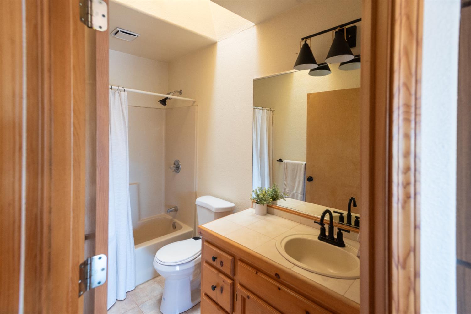 34075 Shaver Springs Road Auberry, CA 93602 - Photo 21 of 38 a bathroom with a sink toilet and shower
