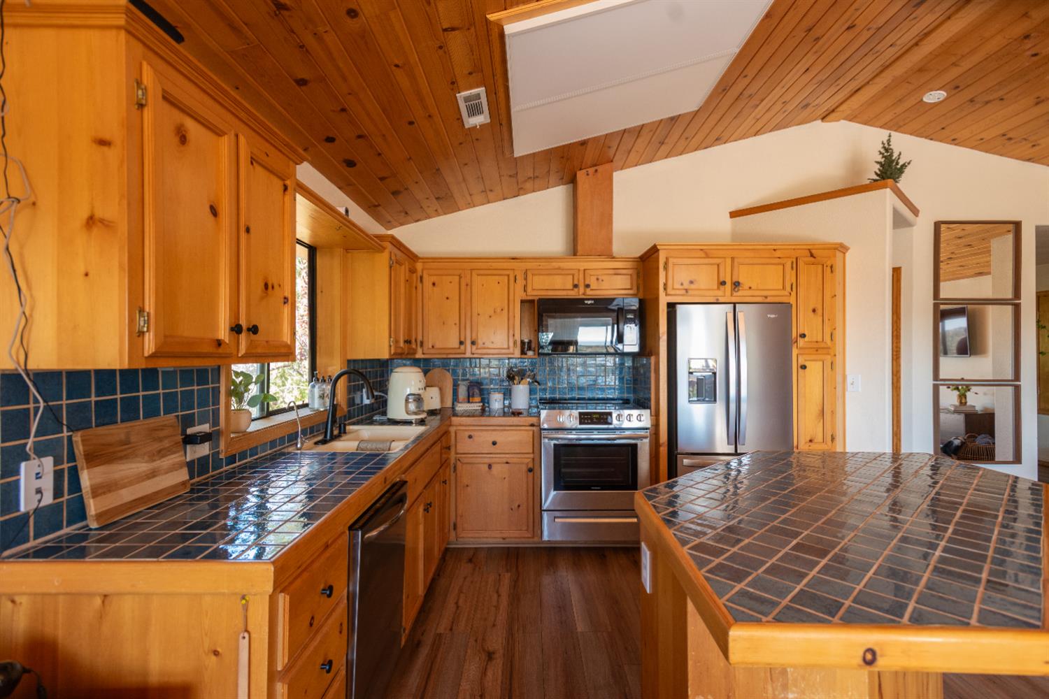 34075 Shaver Springs Road Auberry, CA 93602 - Photo 22 of 38 a kitchen with stainless steel appliances granite countertop a stove a sink and a refrigerator