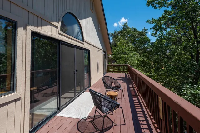a view of a balcony with wooden floor