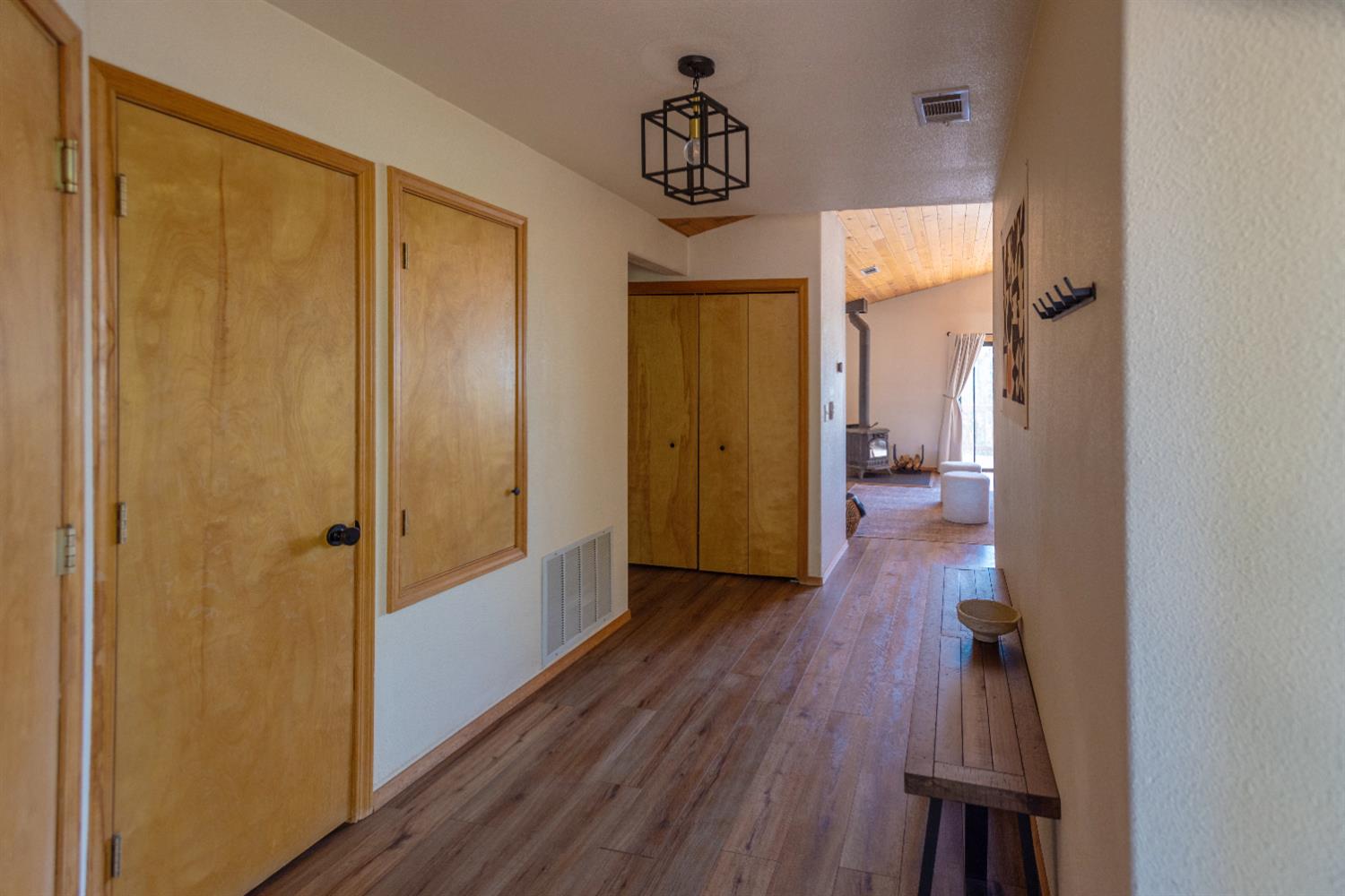 34075 Shaver Springs Road Auberry, CA 93602 - Photo 30 of 38 a view of a hallway with wooden floor and closet