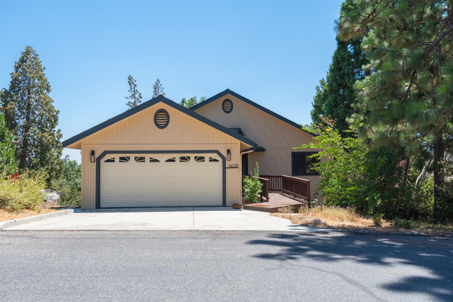 34075 Shaver Springs Road Auberry, CA 93602 - Photo 4 of 38 a front view of a house with a yard and garage