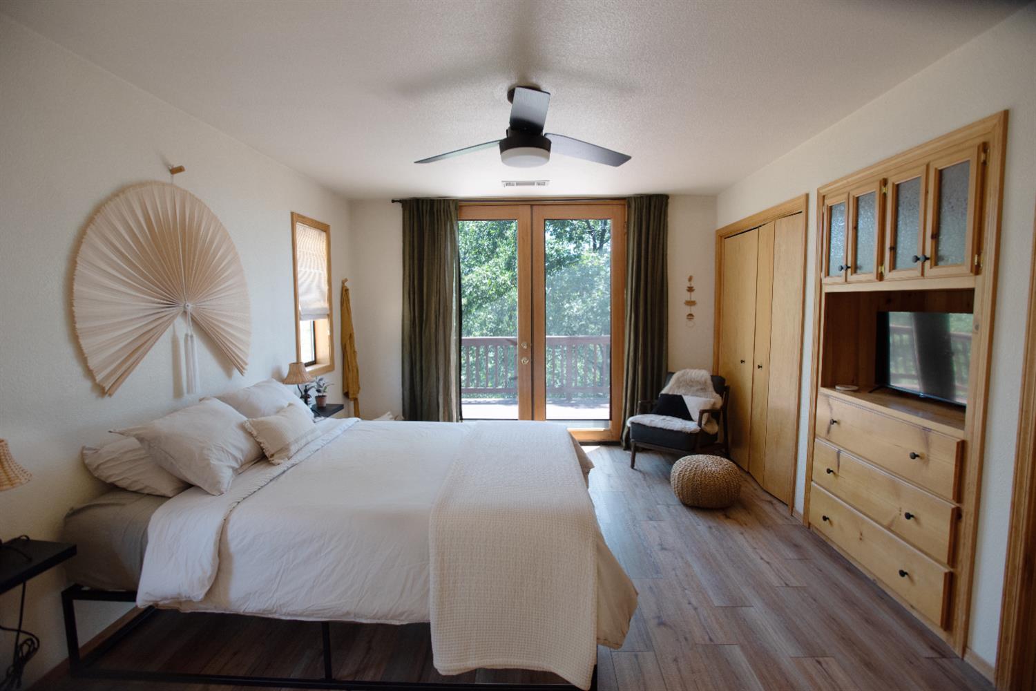 34075 Shaver Springs Road Auberry, CA 93602 - Photo 7 of 38 a bedroom with a bed and wooden floor