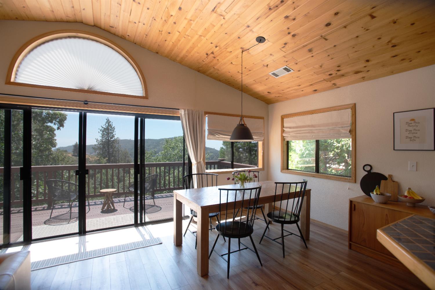 34075 Shaver Springs Road Auberry, CA 93602 - Photo 8 of 38 a view of a dining room with furniture window and wooden floor