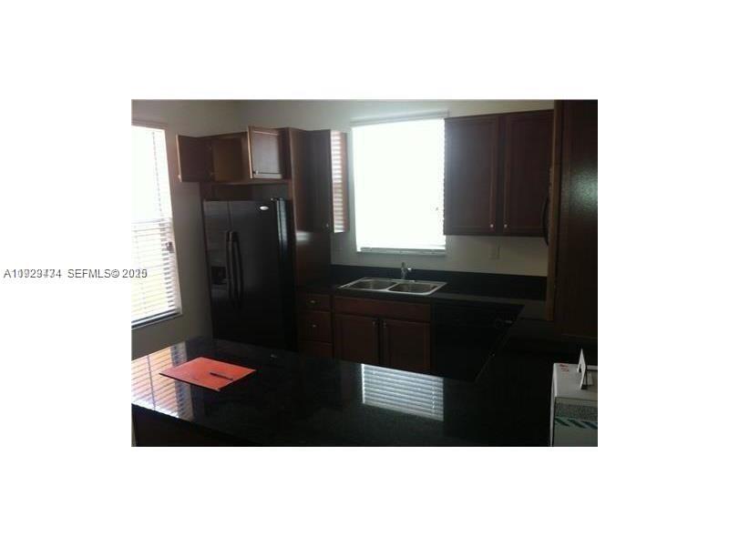 1131 Southwest 147th Avenue Pembroke Pines, FL 33027 - Photo 11 of 15 a bathroom with a sink and a mirror