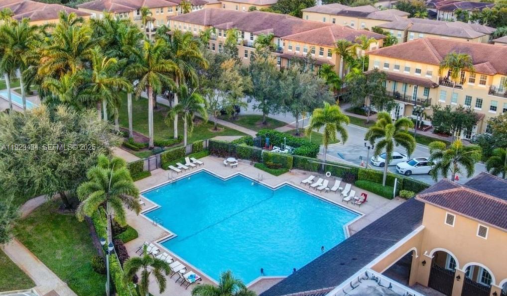 1131 Southwest 147th Avenue Pembroke Pines, FL 33027 - Photo 3 of 15 an aerial view of a tennis ground and a cars park side of the road