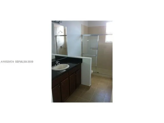 a kitchen with a sink and a stove