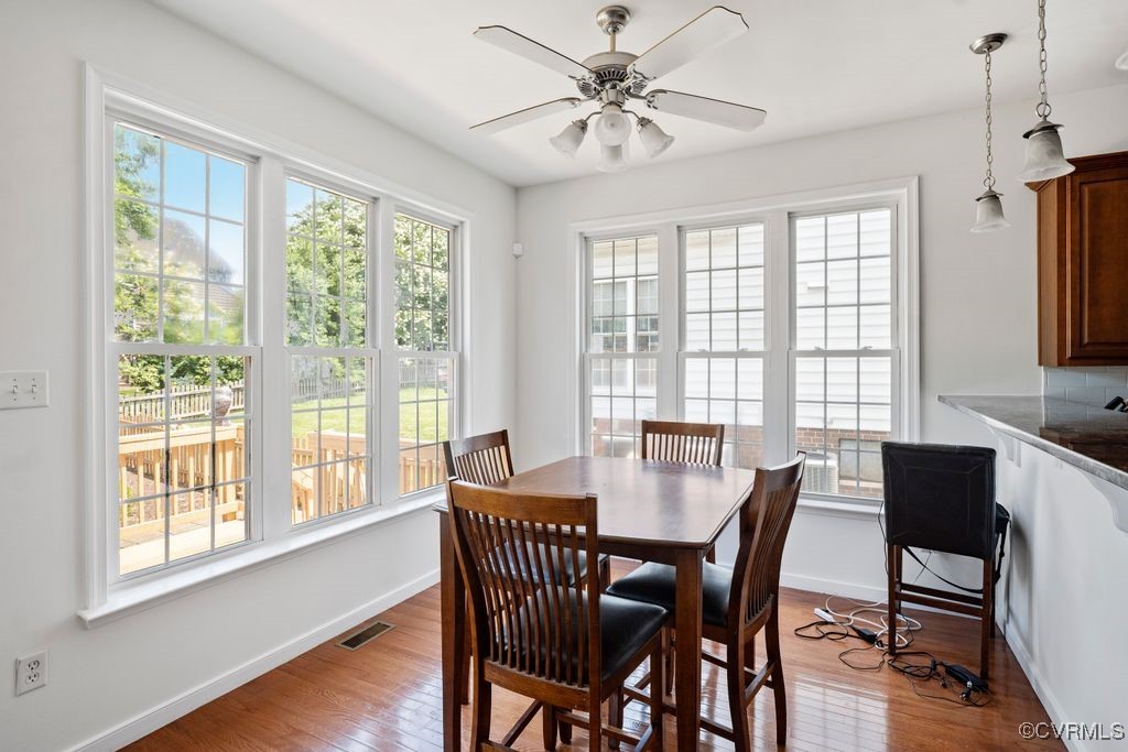 14306 Camack Trail Midlothian, VA 23114 - Photo 15 of 48 a view of a dining room with furniture window and wooden floor