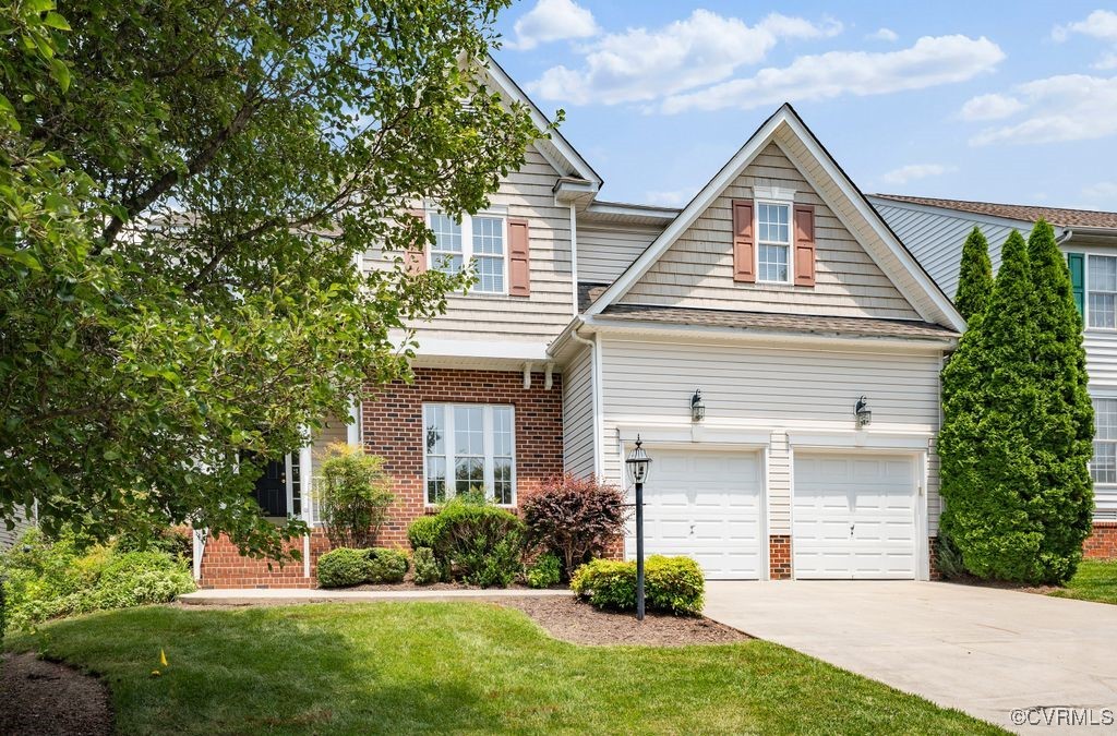 14306 Camack Trail Midlothian, VA 23114 - Photo 2 of 48 a front view of a house with a yard and trees