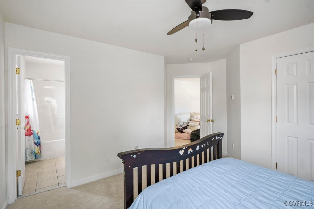14306 Camack Trail Midlothian, VA 23114 - Photo 27 of 48 a bedroom with a bed and a chandelier