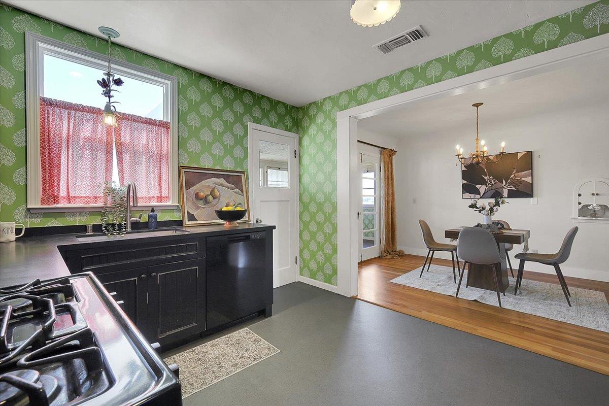 1102 Barry Road Yuba City, CA 95991 - Photo 25 of 88 a kitchen with a table chairs and a stove