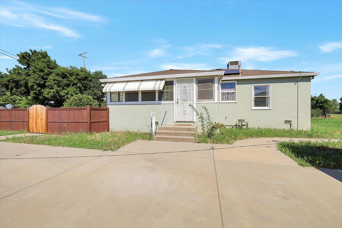 1102 Barry Road Yuba City, CA 95991 - Photo 42 of 88 a front view of a house with a yard and a garage