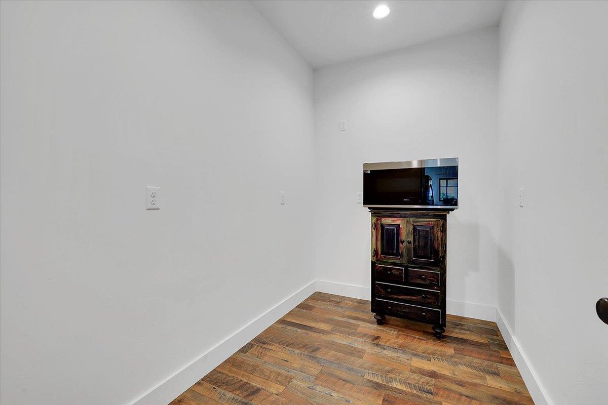 1102 Barry Road Yuba City, CA 95991 - Photo 59 of 88 a view of room with wooden floor and entryway