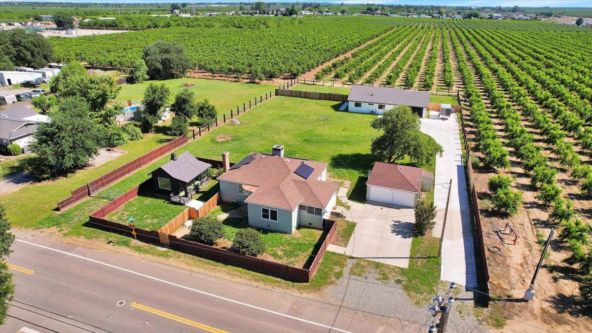 1102 Barry Road Yuba City, CA 95991 - Photo 77 of 88 an aerial view of a house with a garden and swimming pool