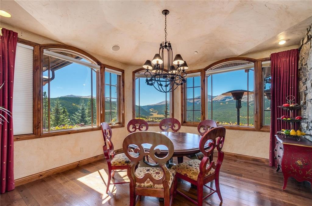 189 Juniata Circle Breckenridge, CO 80424 - Photo 12 of 35 a view of a dining room with furniture window and wooden floor