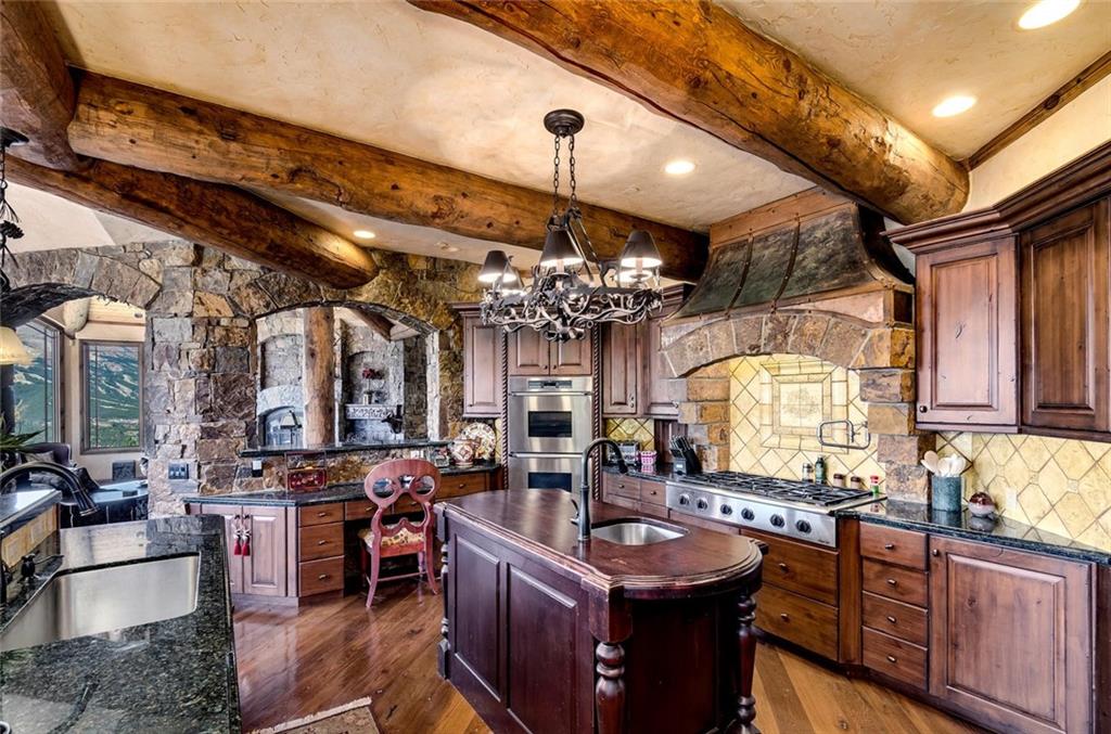 189 Juniata Circle Breckenridge, CO 80424 - Photo 14 of 35 a large kitchen with a table and chairs