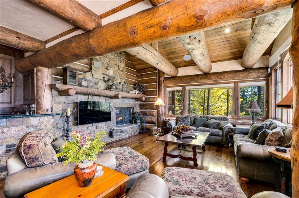 189 Juniata Circle Breckenridge, CO 80424 - Photo 15 of 35 a living room with furniture fireplace and a large window