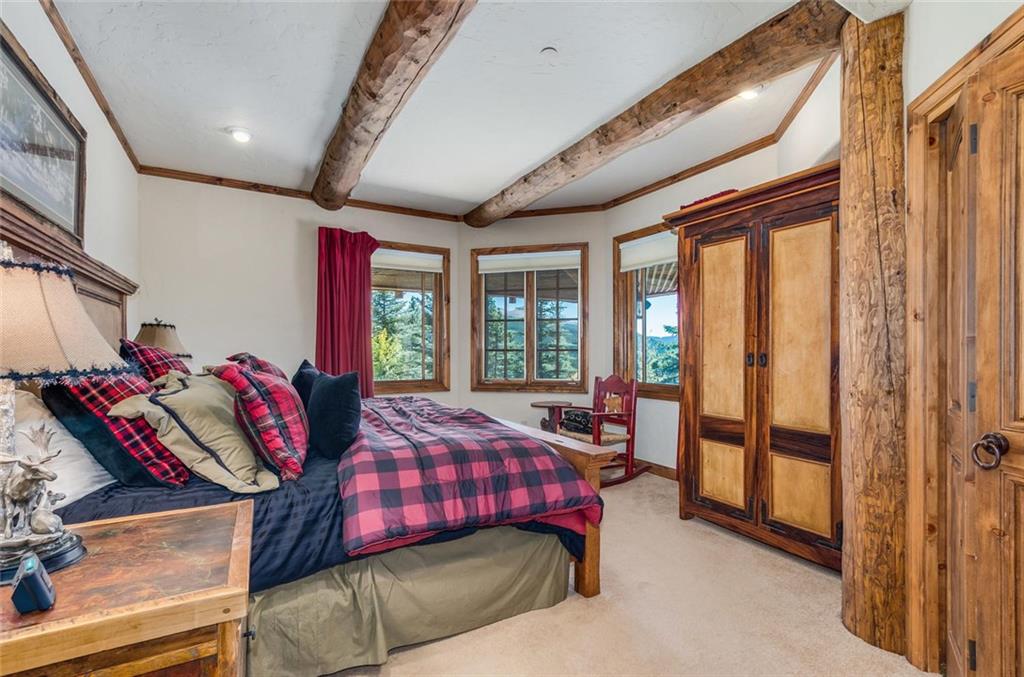 189 Juniata Circle Breckenridge, CO 80424 - Photo 28 of 35 a bedroom with furniture and a large window