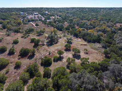 an aerial view of a town with trees