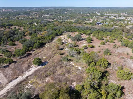 an aerial view of residential house and green space
