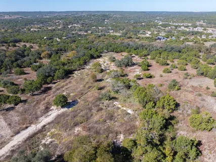 an aerial view of residential house and green space