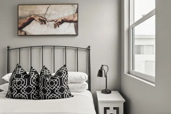 a room with a couch next to a window