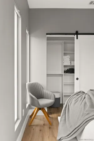 a bedroom with bed and window