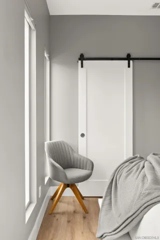 a living room with a couch and a rug