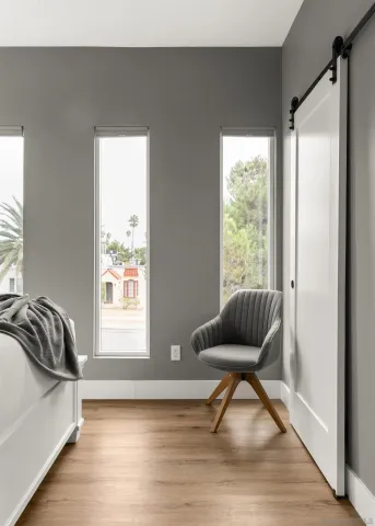 a bedroom with a bed and a window