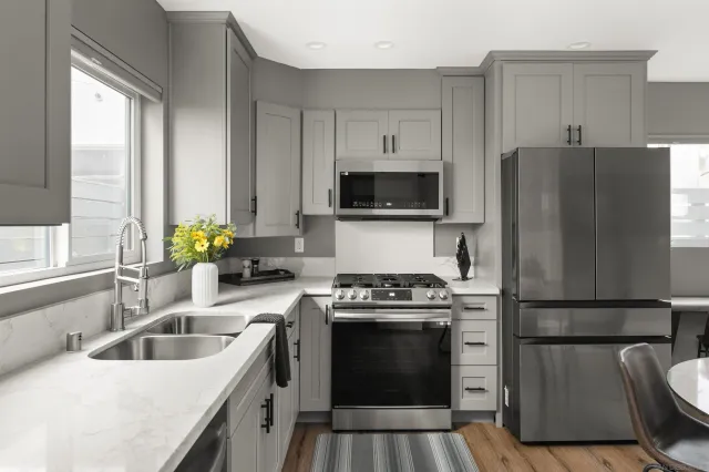 a kitchen with a sink stove and refrigerator