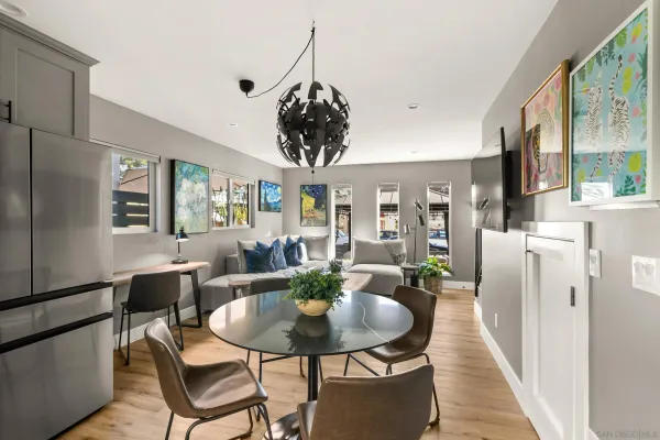 a dining room with furniture and window