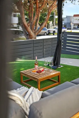 a table and chairs sitting in the garden