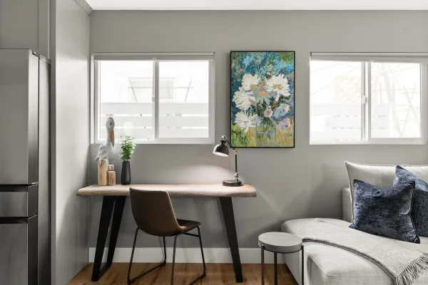 a bedroom with a bed and a table