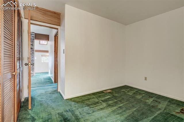 23555 Murphy Road Calhan, CO 80808 - Photo 31 of 49 Empty room featuring dark colored carpet