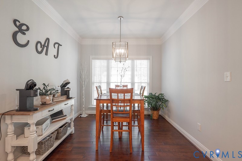 9425 Marie Road New Kent, VA 23124 - Photo 13 of 55 a view of a dining room with furniture window and wooden floor